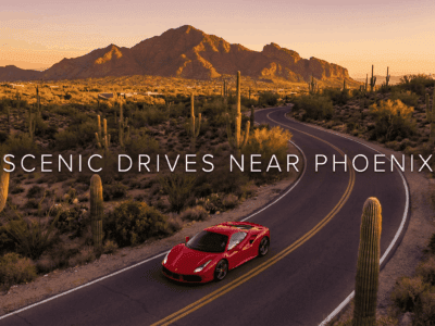 Ferrari driving through Phoenix desert landscape near Camelback Mountain.