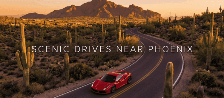 Ferrari driving through Phoenix desert landscape near Camelback Mountain.