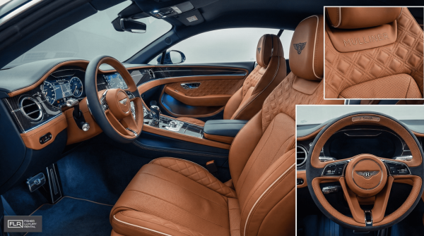 Luxurious interior of a grand tourer featuring leather seats, ambient lighting, and personalized trim.