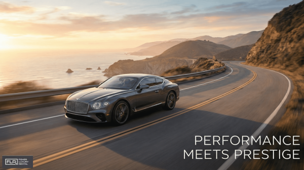 A luxury grand tourer driving on a scenic mountain road at sunset, showcasing elegance and performance.
